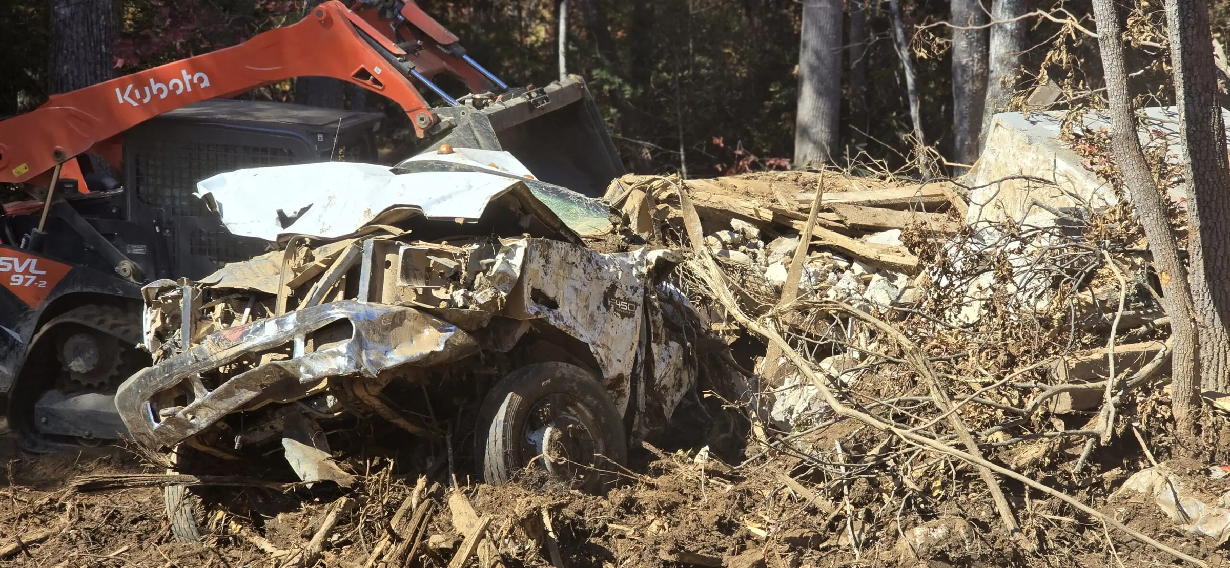 Excavator clearing storm debris