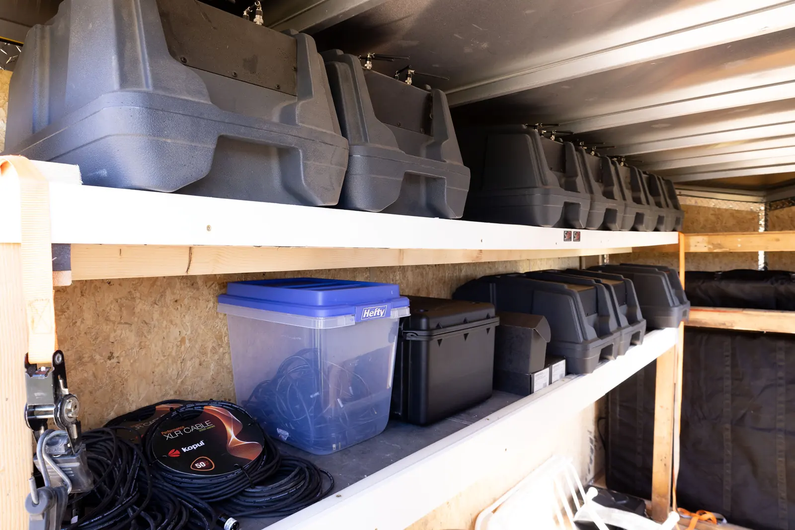 Storage bins inside the sound system trailer