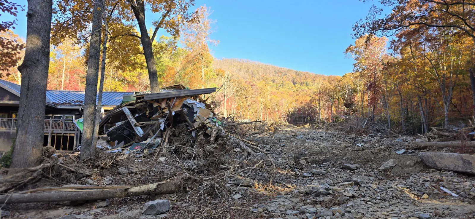 Storm debris near a damaged property in Western North Carolina