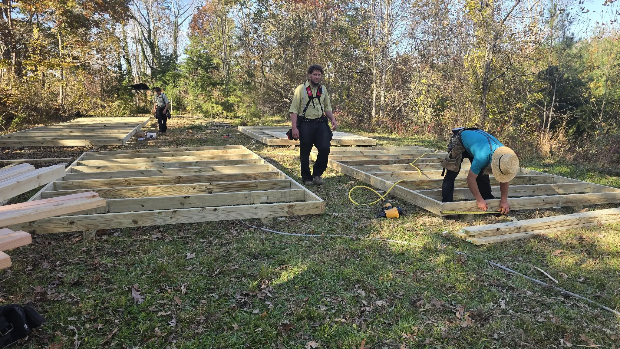 Volunteers assembling frames for tiny homes