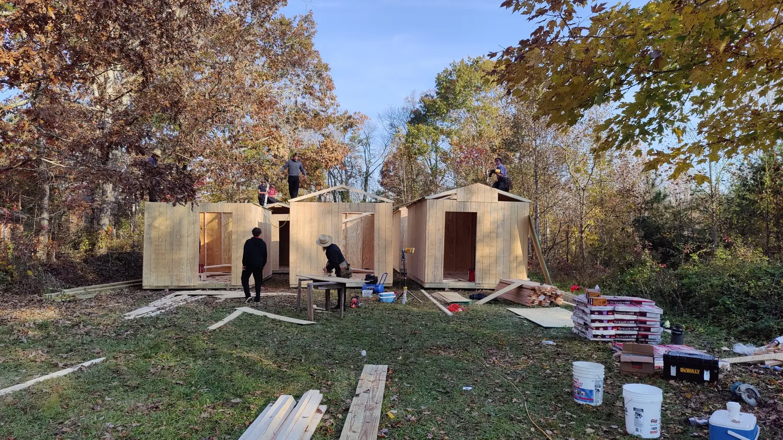 Volunteers building cabins